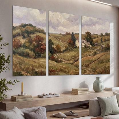 Warm rolling fields and countryside cottages beneath soft clouds set of 3 poster prints displayed in a console