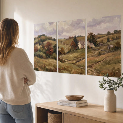 Warm rolling fields and countryside cottages beneath soft clouds set of 3 poster prints three panel arrangement on a wall
