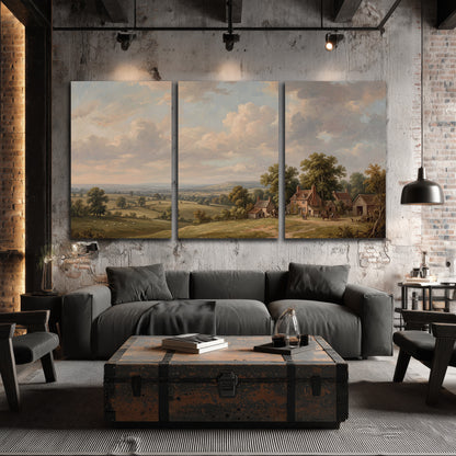 Small cottages overlooking fields beneath a luminous cloudy sky 3 piece canvas wall art displayed in a industrial room