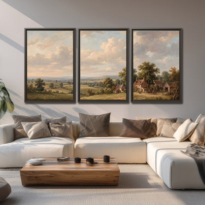 Small cottages overlooking fields beneath a luminous cloudy sky 3 piece framed canvas wall art displayed in a living room