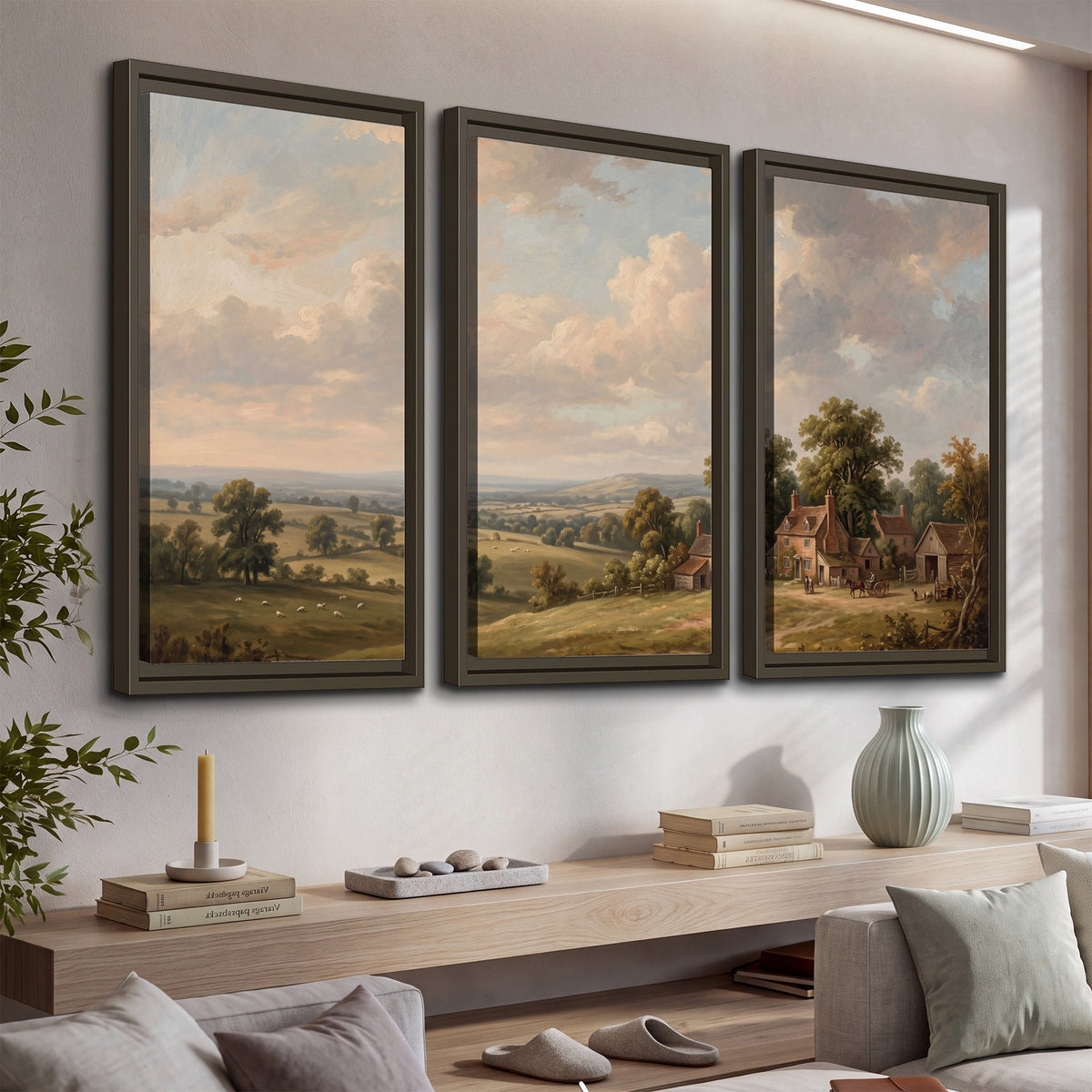 Small cottages overlooking fields beneath a luminous cloudy sky 3 piece framed canvas wall art displayed in a console