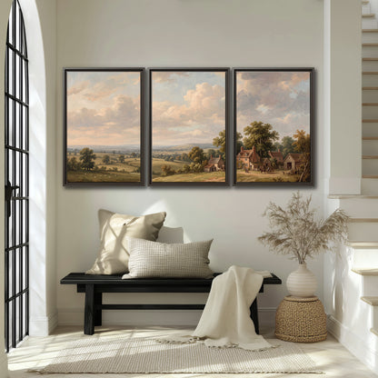 Small cottages overlooking fields beneath a luminous cloudy sky 3 piece framed canvas wall art displayed in a entryway