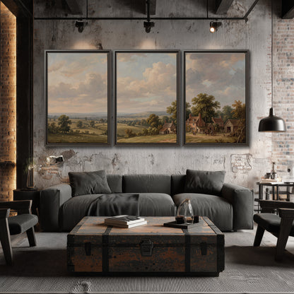 Small cottages overlooking fields beneath a luminous cloudy sky 3 piece framed canvas wall art displayed in a industrial room