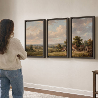 Small cottages overlooking fields beneath a luminous cloudy sky 3 piece framed canvas wall art three panel arrangement on a wall