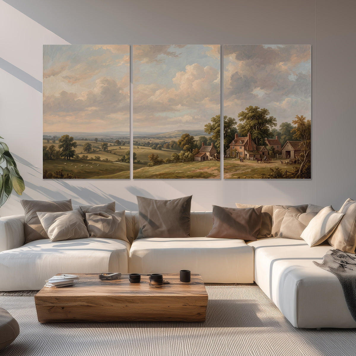 Small cottages overlooking fields beneath a luminous cloudy sky set of 3 poster prints displayed in a living room