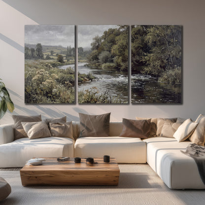 A gently flowing river bordered by olive-green trees and flowers 3 piece canvas wall art displayed in a living room