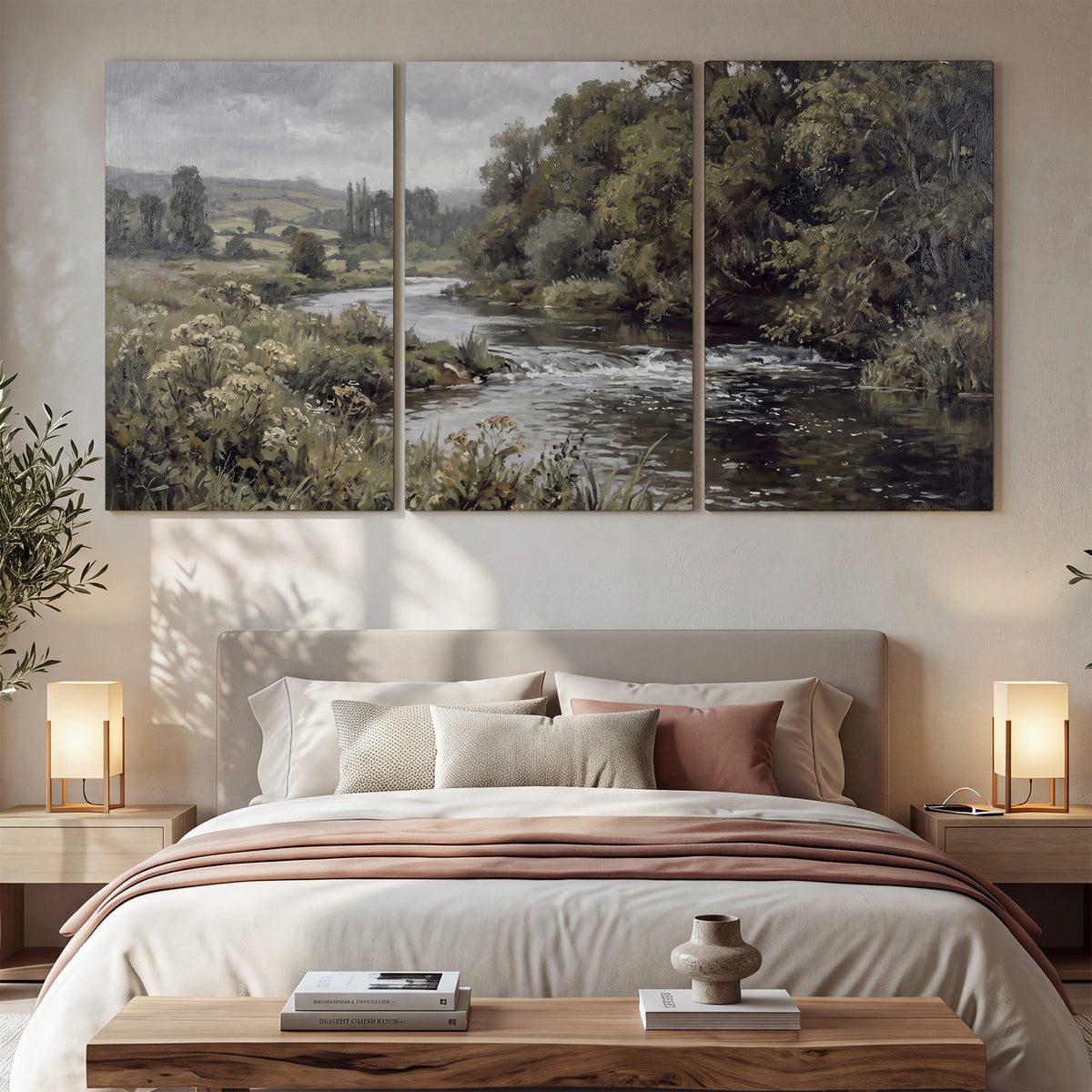 A gently flowing river bordered by olive-green trees and flowers 3 piece canvas wall art displayed in a bedroom