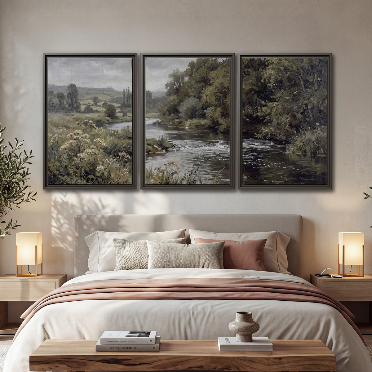 A gently flowing river bordered by olive-green trees and flowers 3 piece framed canvas wall art displayed in a bedroom