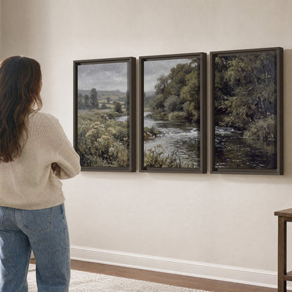 A gently flowing river bordered by olive-green trees and flowers 3 piece framed canvas wall art three panel arrangement on a wall