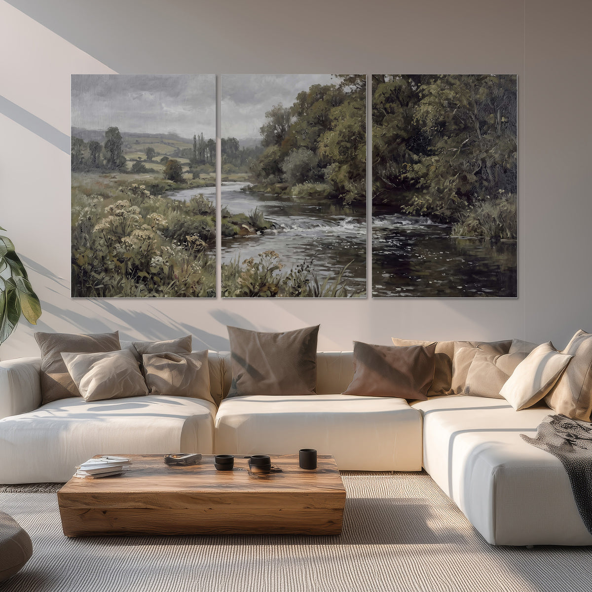 A gently flowing river bordered by olive-green trees and flowers set of 3 poster prints displayed in a living room