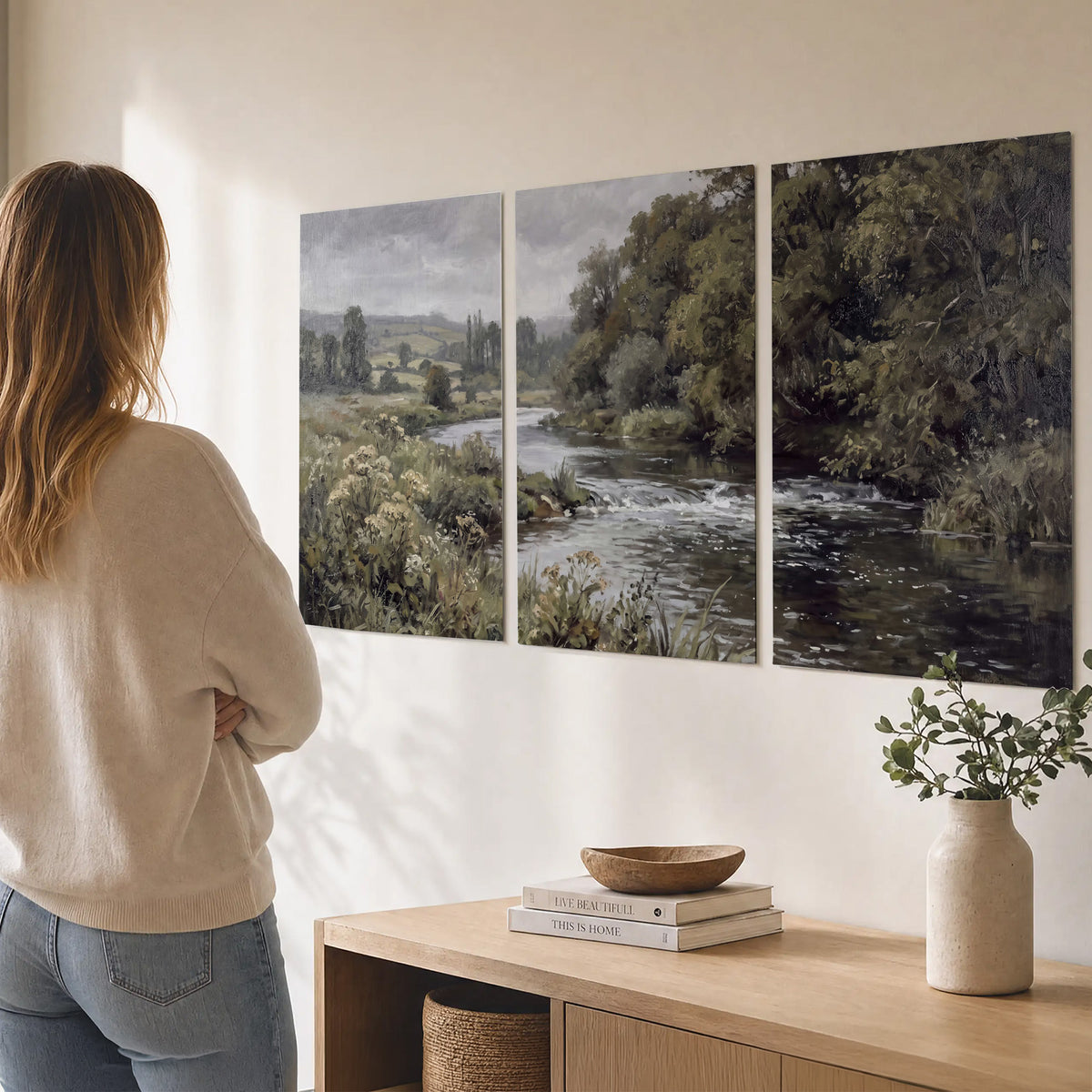 A gently flowing river bordered by olive-green trees and flowers set of 3 poster prints three panel arrangement on a wall