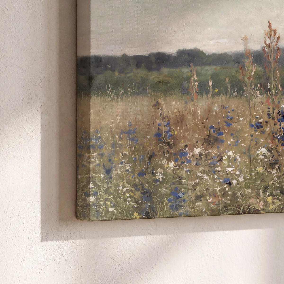 A loose painterly meadow with scattered blue and white wildflowers 3 piece canvas wall art material and edge close up