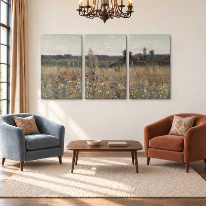 A loose painterly meadow with scattered blue and white wildflowers 3 piece canvas wall art styled in an interior