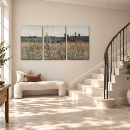 A loose painterly meadow with scattered blue and white wildflowers 3 piece canvas wall art styled in an interior