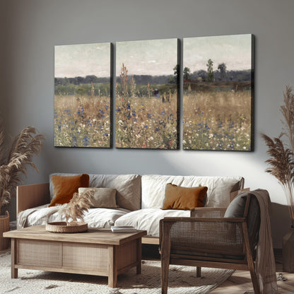 A loose painterly meadow with scattered blue and white wildflowers 3 piece canvas wall art displayed in a rustic living room