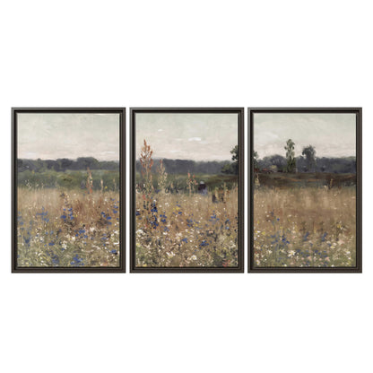 A loose painterly meadow with scattered blue and white wildflowers 3 piece framed canvas wall art viewed straight on