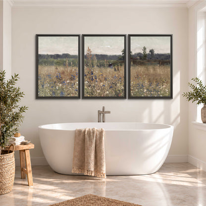 A loose painterly meadow with scattered blue and white wildflowers 3 piece framed canvas wall art styled in an interior