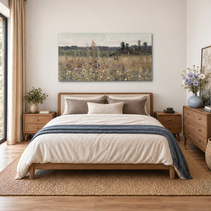 A loose painterly meadow with scattered blue and white wildflowers single canvas wall art styled in an interior