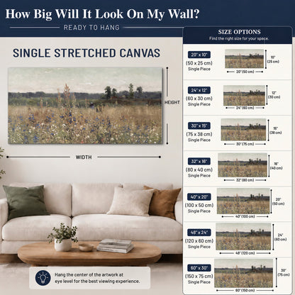 A loose painterly meadow with scattered blue and white wildflowers single canvas wall art size guide above a sofa; room view is illustrative