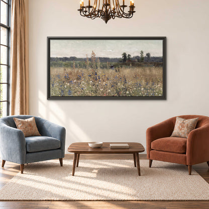 A loose painterly meadow with scattered blue and white wildflowers single framed canvas wall art styled in an interior