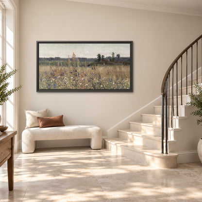 A loose painterly meadow with scattered blue and white wildflowers single framed canvas wall art styled in an interior
