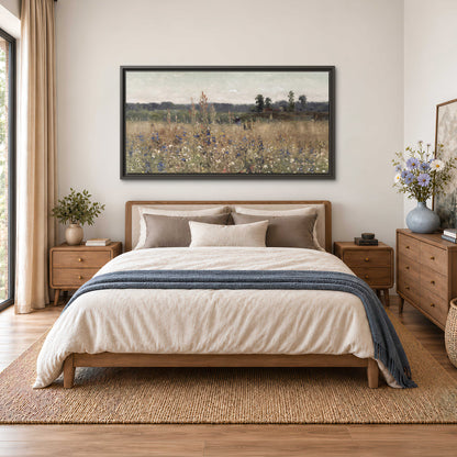 A loose painterly meadow with scattered blue and white wildflowers single framed canvas wall art styled in an interior