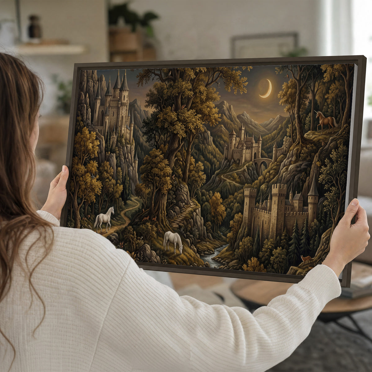 Fantasy castles, white horses and golden trees beneath a crescent moon single framed canvas wall art held in hands