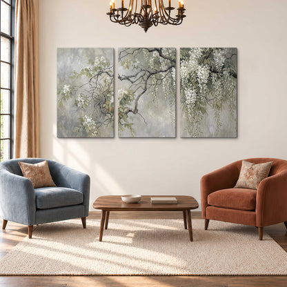 Trailing white blossoms and delicate green branches on pale gray 3 piece canvas wall art styled in an interior