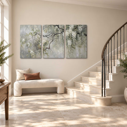 Trailing white blossoms and delicate green branches on pale gray 3 piece canvas wall art styled in an interior