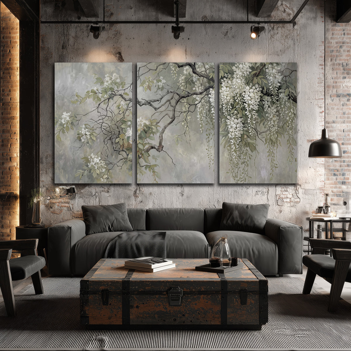 Trailing white blossoms and delicate green branches on pale gray 3 piece canvas wall art displayed in a industrial room