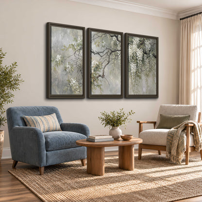 Trailing white blossoms and delicate green branches on pale gray 3 piece framed canvas wall art styled in an interior