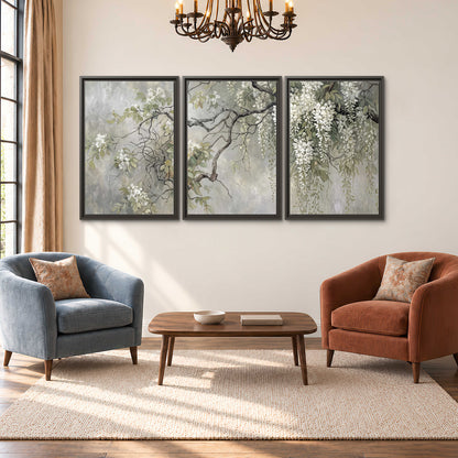 Trailing white blossoms and delicate green branches on pale gray 3 piece framed canvas wall art styled in an interior