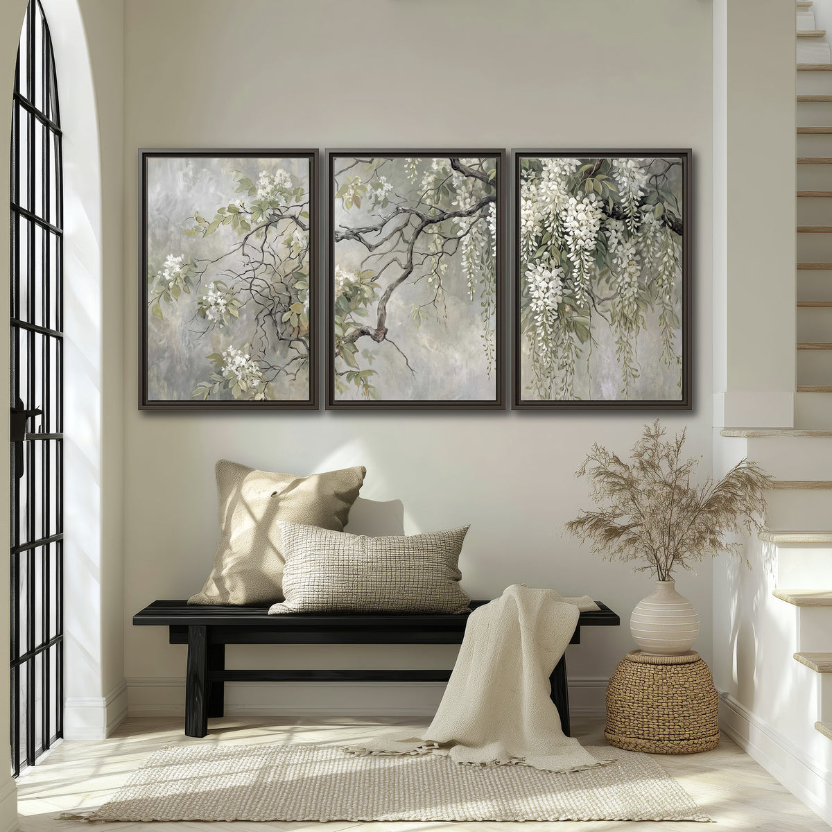 Trailing white blossoms and delicate green branches on pale gray 3 piece framed canvas wall art displayed in a entryway