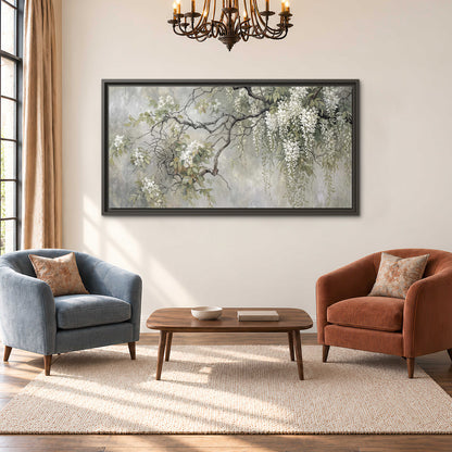 Trailing white blossoms and delicate green branches on pale gray single framed canvas wall art styled in an interior