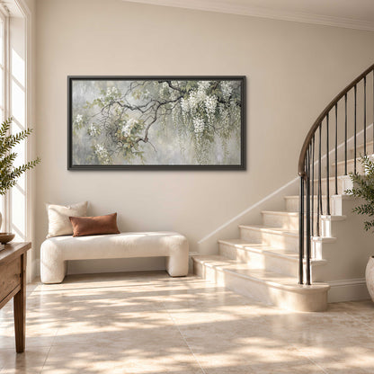 Trailing white blossoms and delicate green branches on pale gray single framed canvas wall art styled in an interior