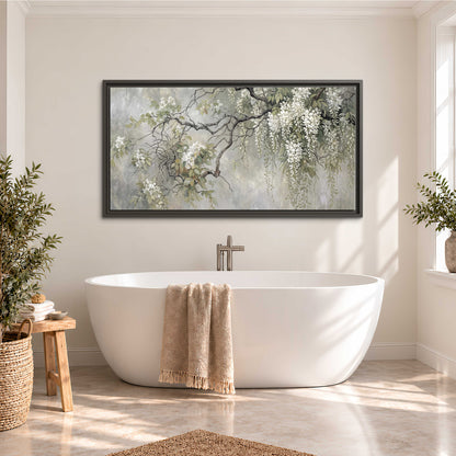 Trailing white blossoms and delicate green branches on pale gray single framed canvas wall art styled in an interior
