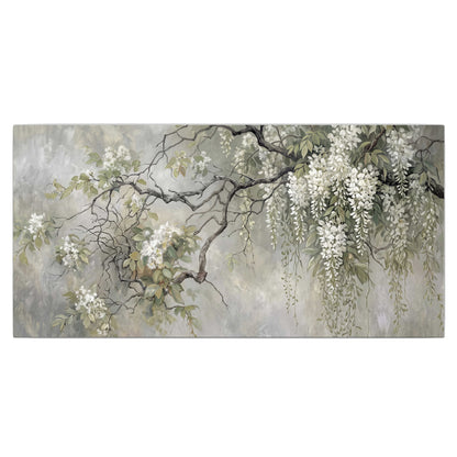 Trailing white blossoms and delicate green branches on pale gray single canvas wall art viewed straight on