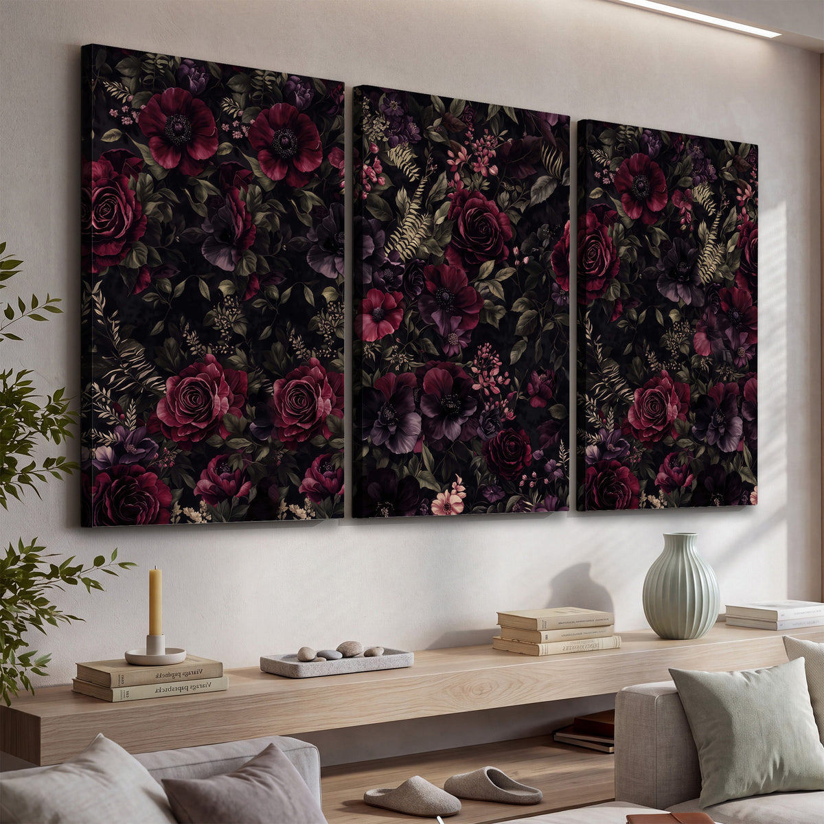Deep burgundy roses and small pale flowers on a dark background 3 piece canvas wall art displayed in a console