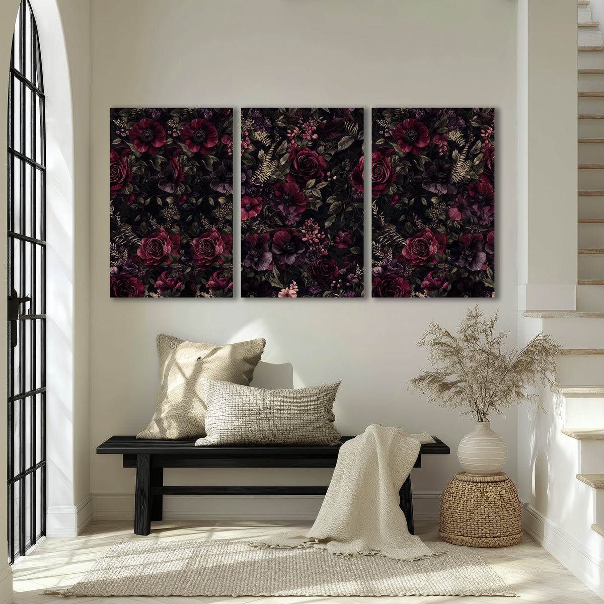 Deep burgundy roses and small pale flowers on a dark background 3 piece canvas wall art displayed in a entryway
