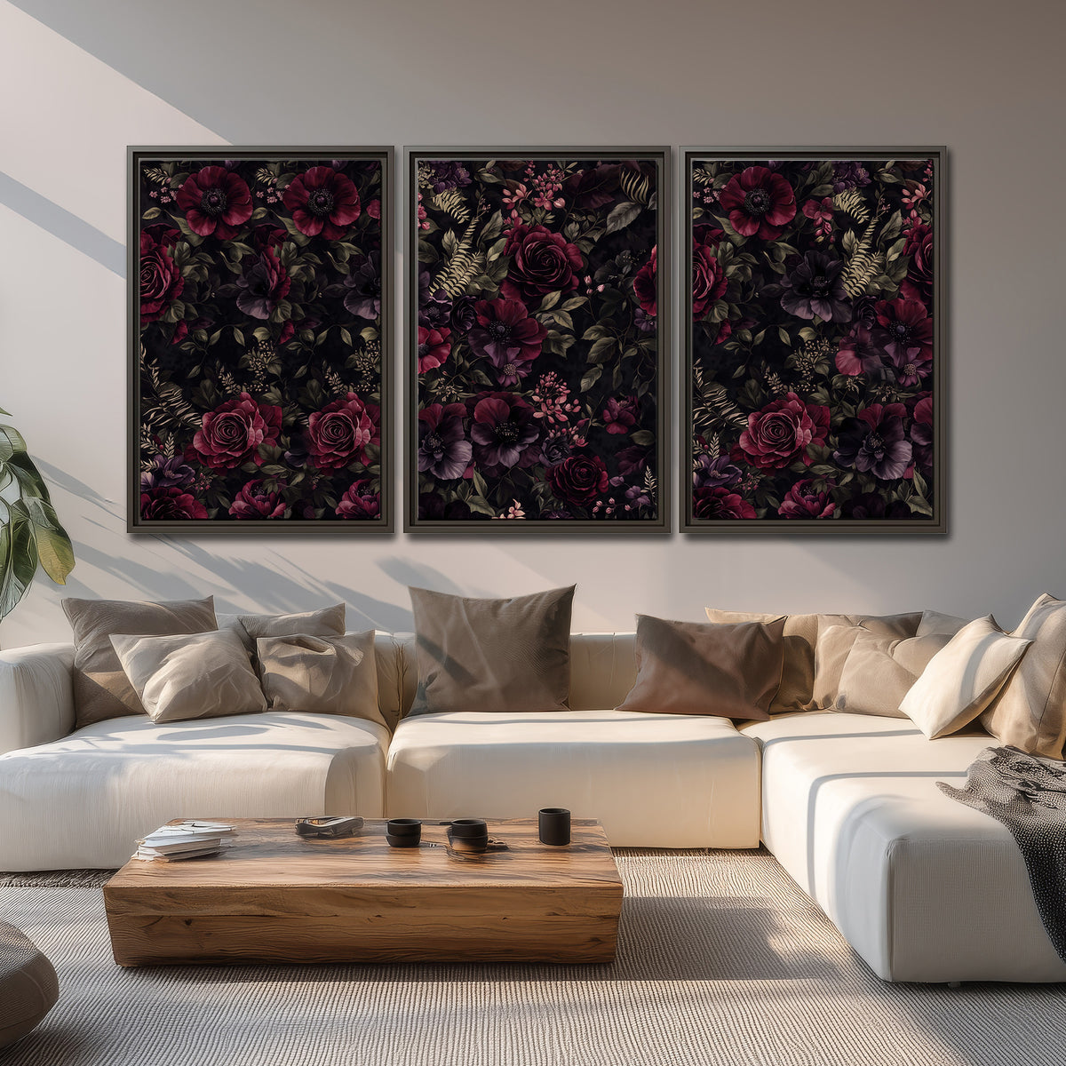 Deep burgundy roses and small pale flowers on a dark background 3 piece framed canvas wall art displayed in a living room