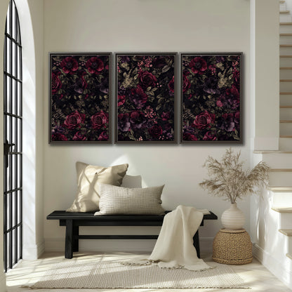 Deep burgundy roses and small pale flowers on a dark background 3 piece framed canvas wall art displayed in a entryway
