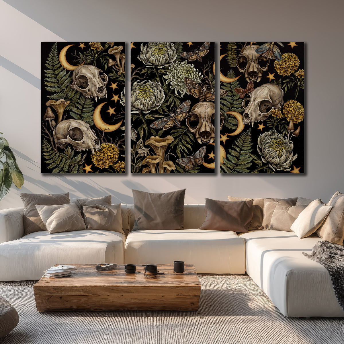 Decorative animal skulls, moons, stars, mushrooms and botanical leaves 3 piece canvas wall art displayed in a living room