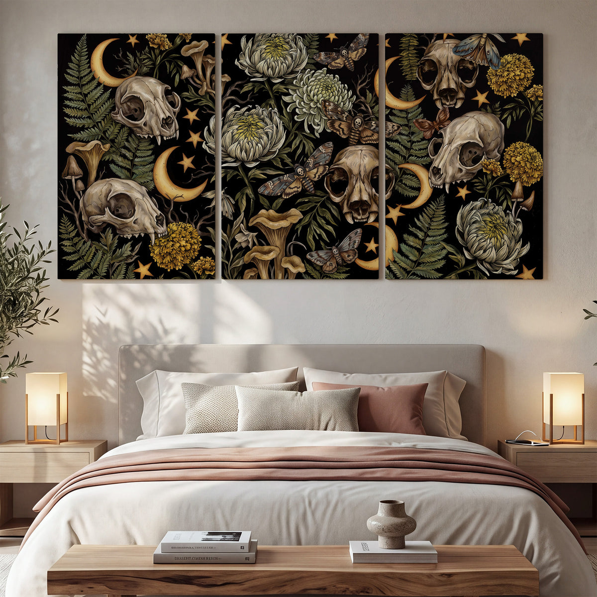 Decorative animal skulls, moons, stars, mushrooms and botanical leaves 3 piece canvas wall art displayed in a bedroom