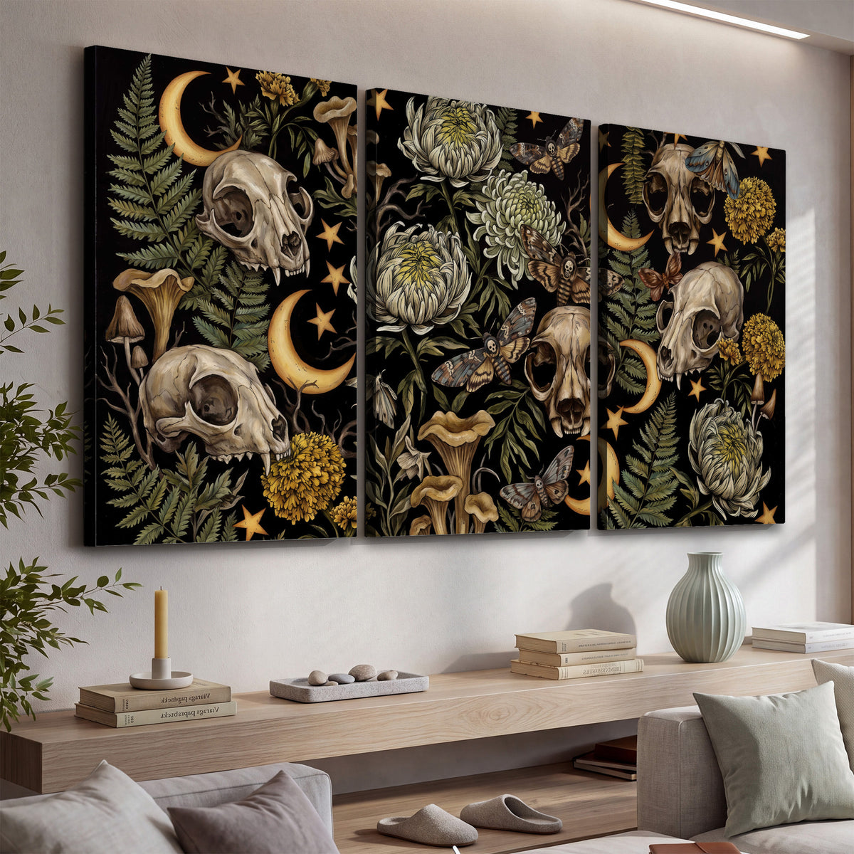 Decorative animal skulls, moons, stars, mushrooms and botanical leaves 3 piece canvas wall art displayed in a console