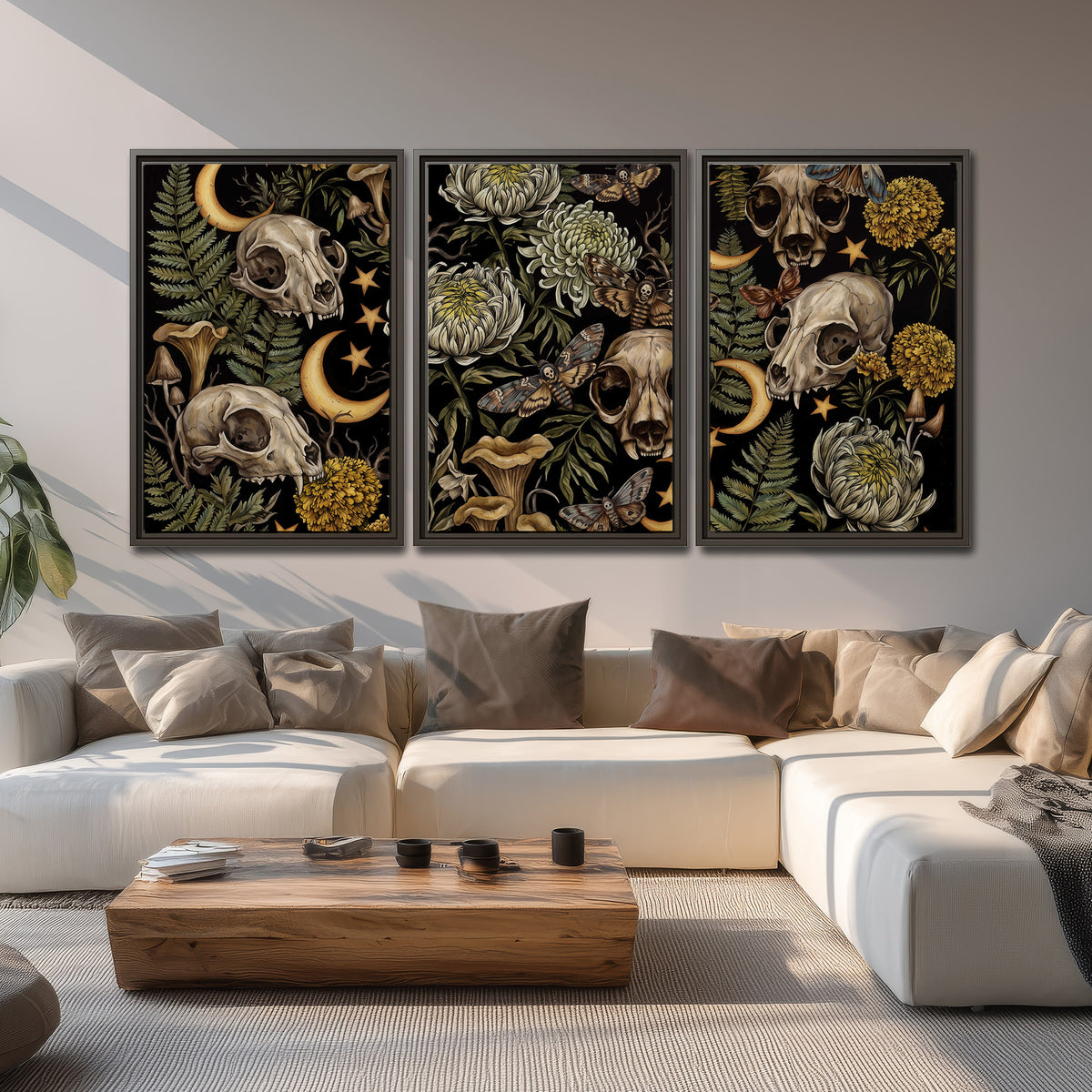 Decorative animal skulls, moons, stars, mushrooms and botanical leaves 3 piece framed canvas wall art displayed in a living room