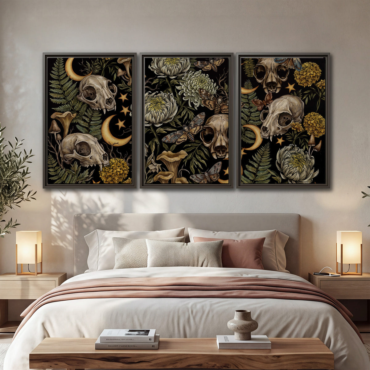 Decorative animal skulls, moons, stars, mushrooms and botanical leaves 3 piece framed canvas wall art displayed in a bedroom