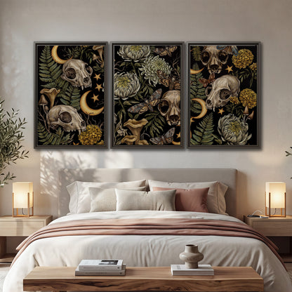 Decorative animal skulls, moons, stars, mushrooms and botanical leaves 3 piece framed canvas wall art displayed in a bedroom