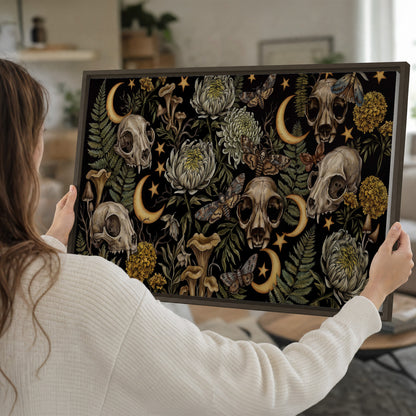 Decorative animal skulls, moons, stars, mushrooms and botanical leaves single framed canvas wall art held in hands