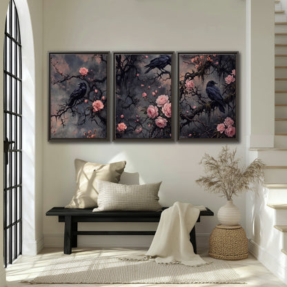 Black ravens perched among pink roses and dark branches 3 piece framed canvas wall art displayed in a entryway