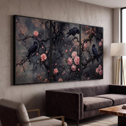 Black ravens perched among pink roses and dark branches 3 piece framed canvas wall art displayed in a modern living room
